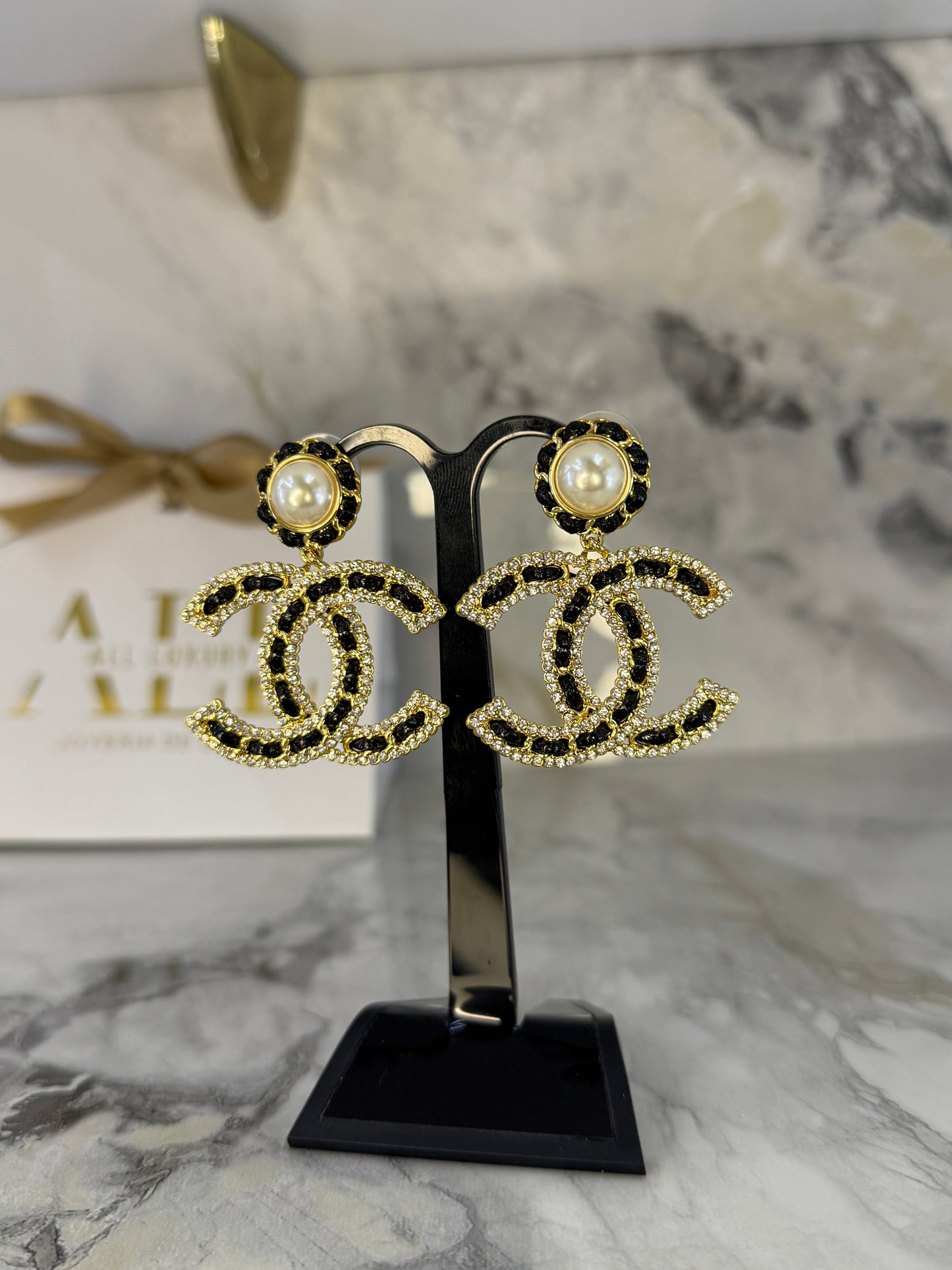 aretes chanel XL negros trenzados