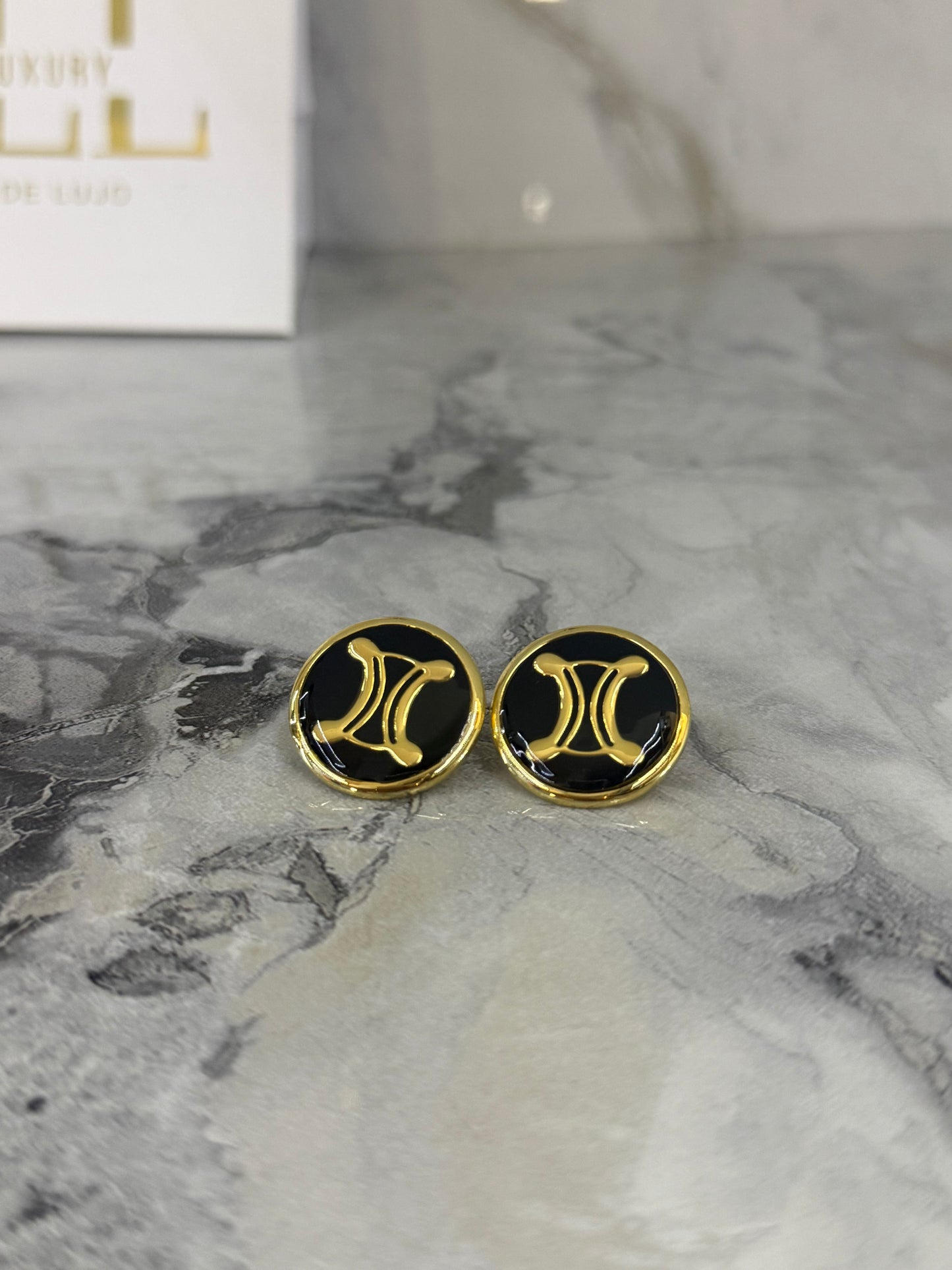 aretes celine negros