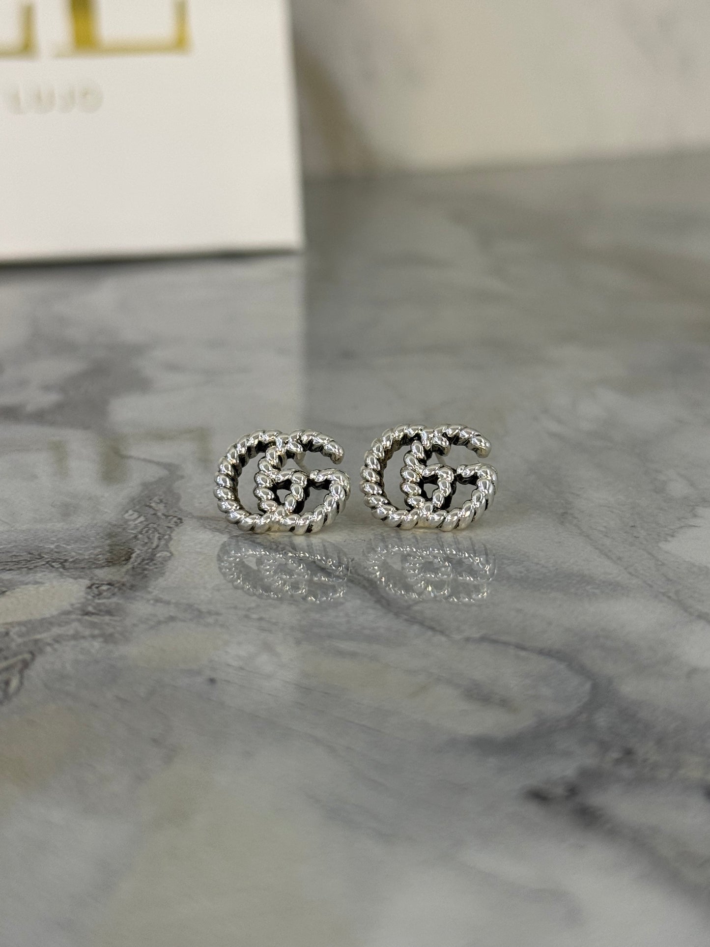 aretes gucci logo lineas