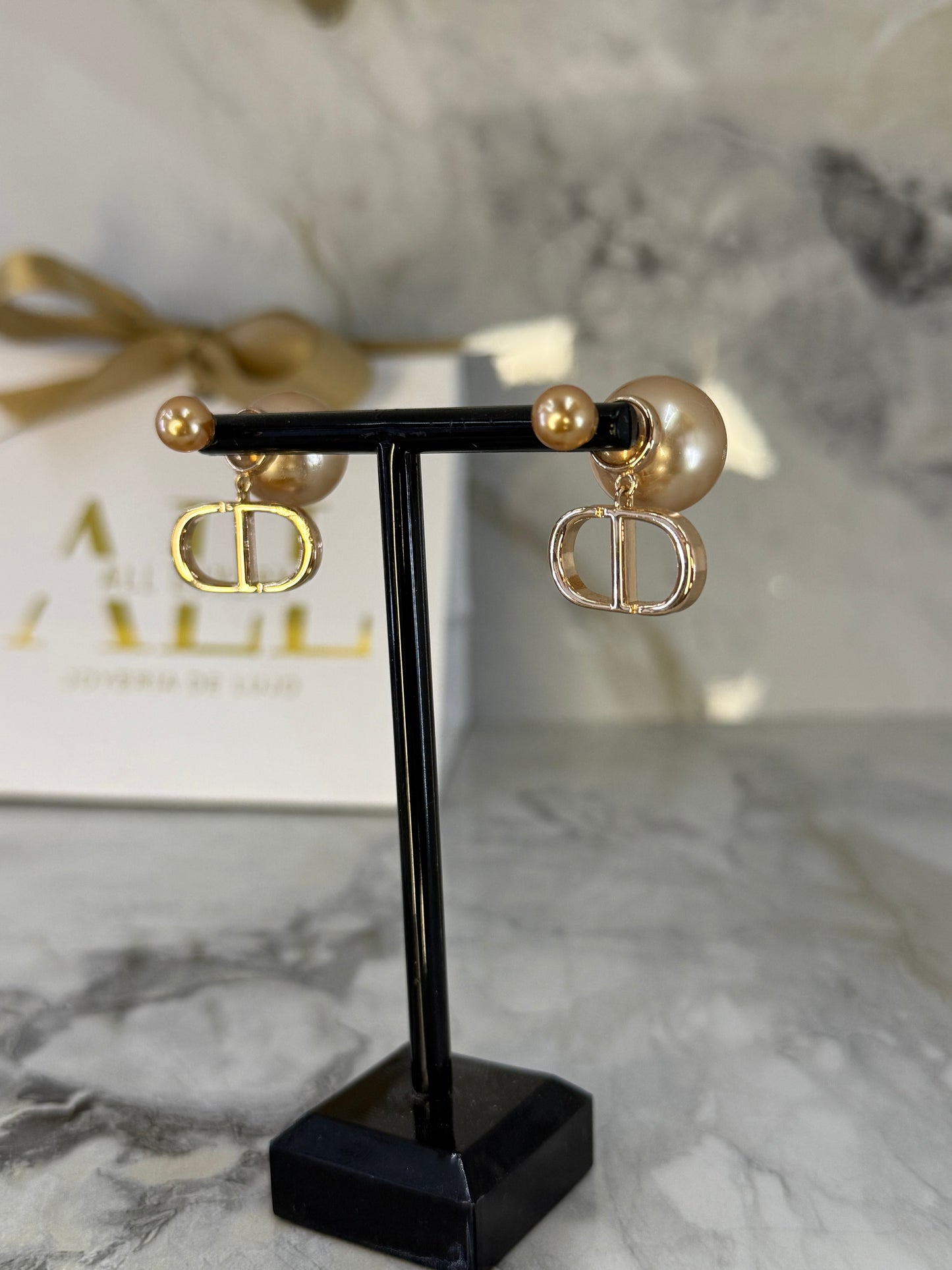 aretes Dior tribales oro rosa