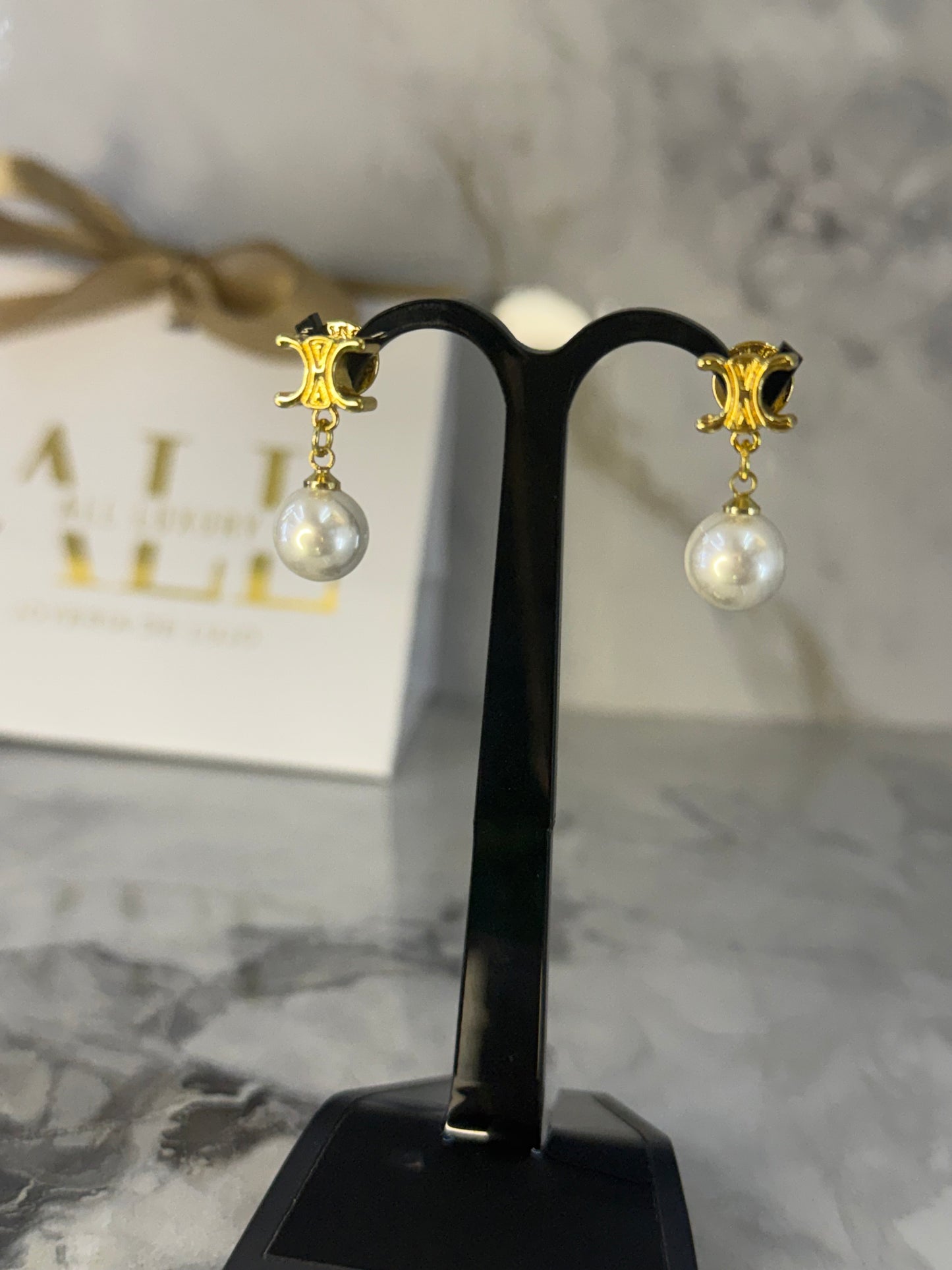 aretes Celine perla colgante