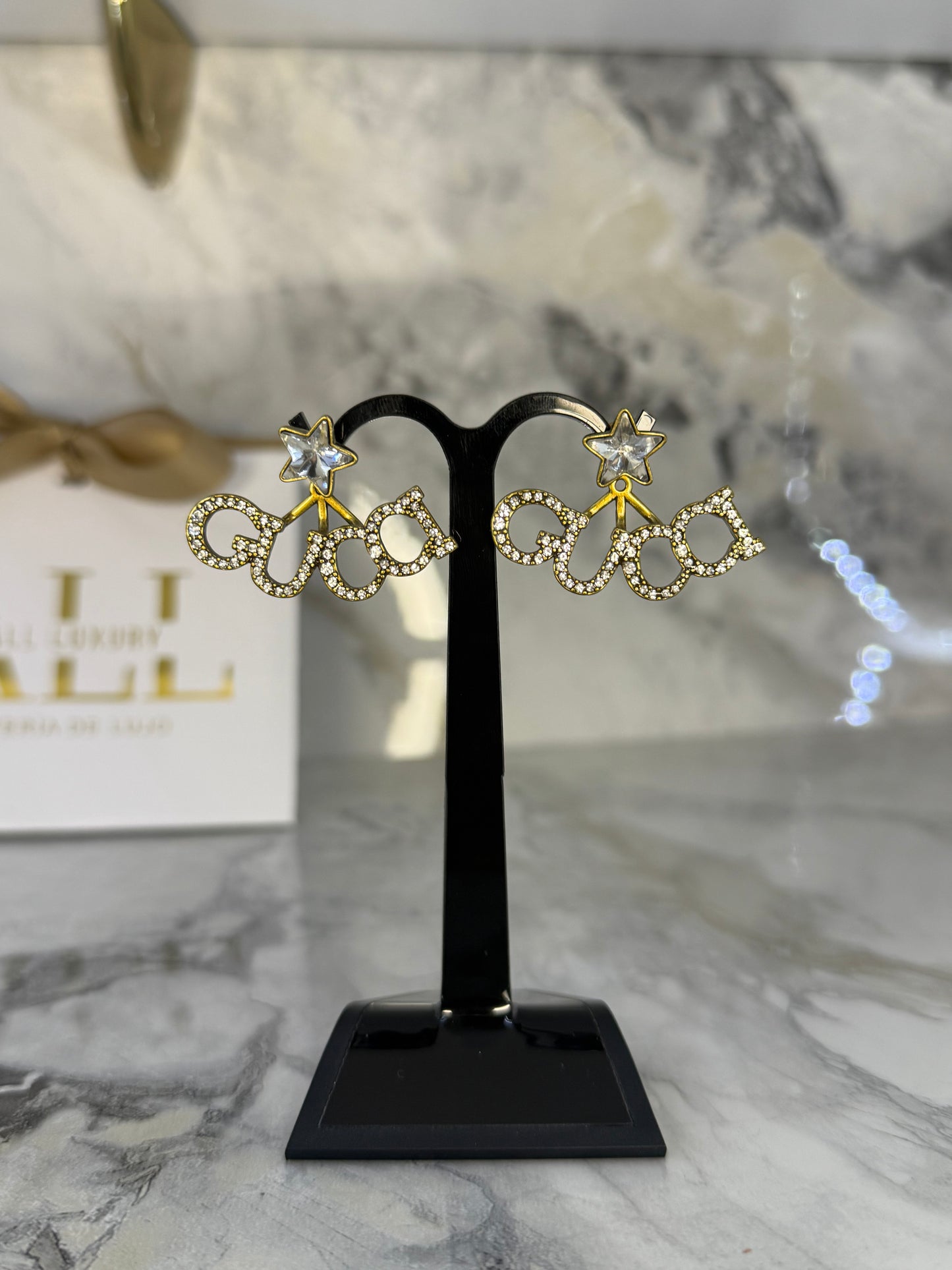 aretes gucci estrella
